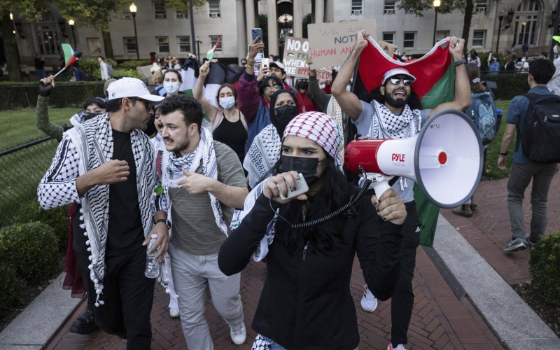 protesters holding flag and megaphone