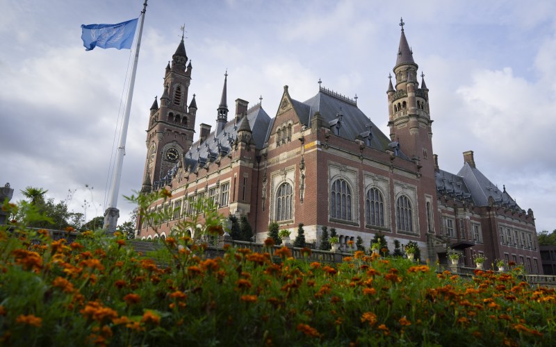 Building with a flag in front 