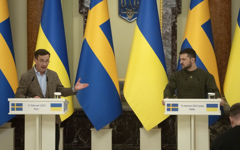 two men standing at podiums 