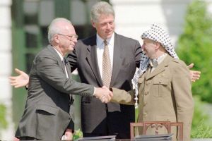 Israeli Prime Minister Yitzhak Rabin, U.S. president Bill Clinton, and PLO chairman Yasser Arafat.