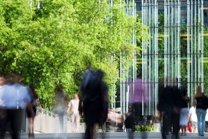 People walking in blurred motion through the Financial District of Paris, France.