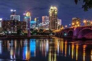 Minneapolis skyline and bridge seen from across the river. 