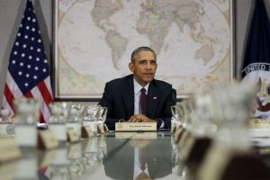 President Obama in front of a world map.