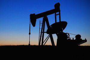 A pump jack in an oil field. 