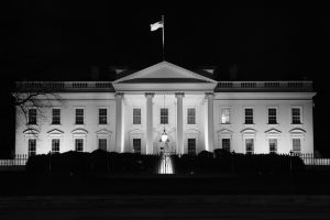 An image of the White House seen at night. 