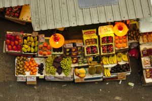 An aerial view of produce stands at a street market