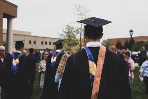 A student wearing a graduation cap and gown