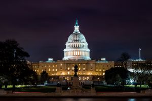 An exterior shot of the US Capitol building at night