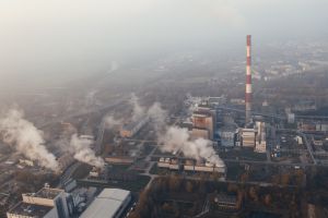 An aerial view of smoke coming out a factory