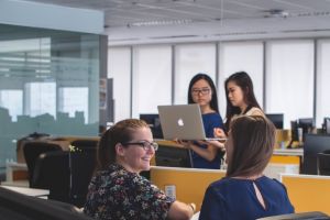 People talking and working collaboratively in an office