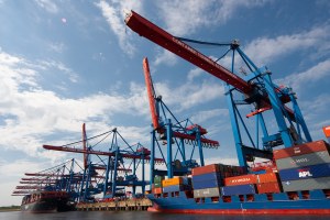 a cargo ship stacked with shipping containers