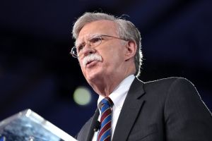 John Bolton speaking at a podium