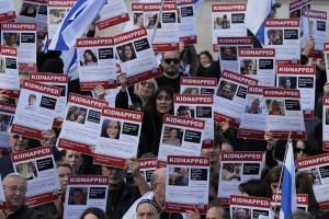 Israeli supports show placards with the faces and names of people believed to be taken hostage and held in Gaza.