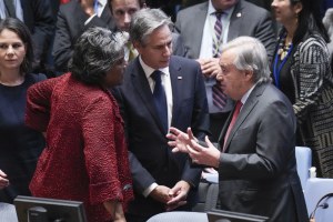 US Secretary of State Antony Blinken, center, and U.S. Ambassador to the United Nations Linda Thomas-Greenfield, left, talk with UN Secretary-General Antonio Guterres.