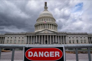 a danger sign in front of the US Capitol