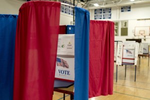 Voting booths are set up in a high school gymnasium