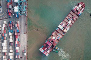 a container ship near a dock