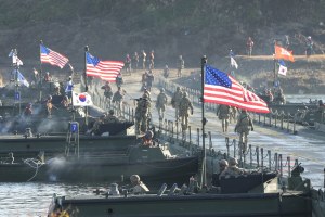 Flags of South Korea and the United States flutter before a joint river-crossing drill between South Korea and the United States