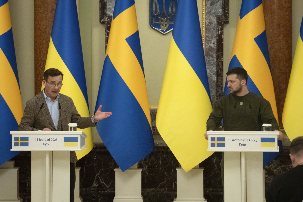 two men standing at podiums 