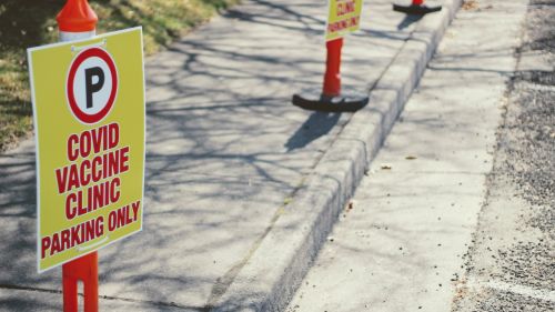 Traffic cones mark parking areas for COVID-19 vaccination sites.