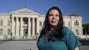 Rosa Anaya Perla in front of the National Palace of El Salvador