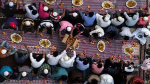 View of a group of people passing around plates of food