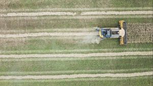 A field being tilled with a tractor. 