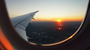 View of a sunset from an airplane window. 