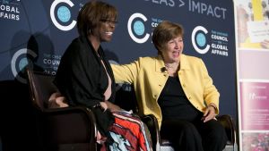 Two women talk on stage during the symposium