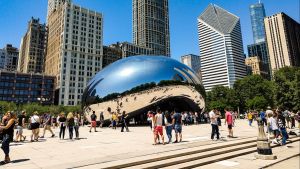 Cloud Gate, also known as "The Bean," sculpture in Chicago with people surrounding it.