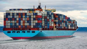 a boat filled with shipping containers