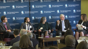 Five people talk on-stage during a Council program