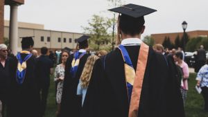 A student wearing a graduation cap and gown