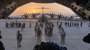 Soldiers in Afghanistan viewed from inside plane.