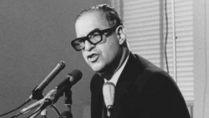 Abba Eban speaking into a microphone