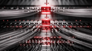 Close up view of wires going into a machine with red lights