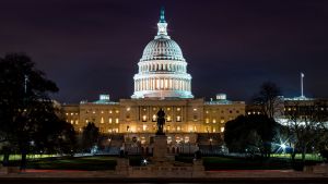 An exterior shot of the US Capitol building at night