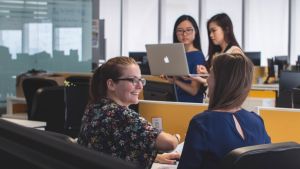 People talking and working collaboratively in an office