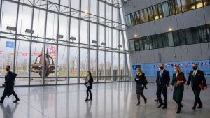 NATO Secretary General Jens Stoltenberg crosses a lobby to meet with Elizabeth Truss, UK Secretary of State for Foreign, Commonwealth and Development Affairs