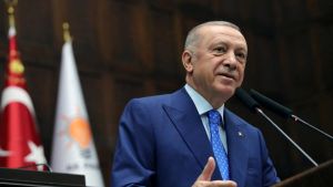 Turkish President Erdogan addresses members of AKP during a meeting at the parliament in Ankara