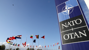 Flags wave outside the NATO headquarters.