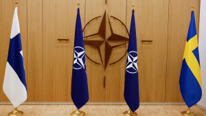 The flags of Finland, NATO and Sweden stand on display during a ceremony to mark Sweden's and Finland's application for membership in Brussels, Belgium, May 18, 2022