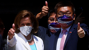 Speaker Nancy Pelosi gestures next to Legislative Yuan Vice President Tsai Chi-chang as she leaves the parliament in Taipei, Taiwan on August 3, 2022.