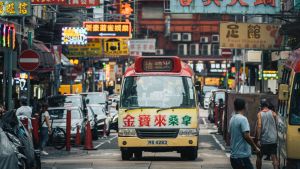 A van drives through an urban Hong Kong street