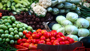 A variety of vegetables are pictured at a grocery store.