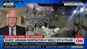 Screenshot of Ivo speaking on CNN Newsroom next to footage of the missile explosion site in Poland. 