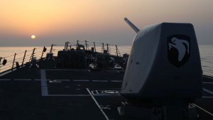 Arleigh Burke-class destroyer USS Milius (DDG 69) during a routine patrol in the Taiwan Strait at sunset.