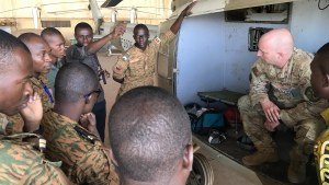 Master Sgt. Todd Chandler leads a group discussion from the Burkina Faso air force at Airbase 511 