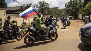  Supporters of Capt. Ibrahim Traore parade wave a Russian flag in the streets of Ouagadougou