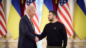 Ukrainian President Volodymyr Zelenskyy and US President Joe Biden shake hands during their meeting in Kyiv